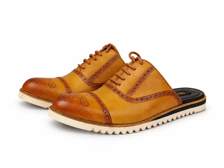 Mustard cognac brogue lace-up mules with cream soles and soft contact shadows