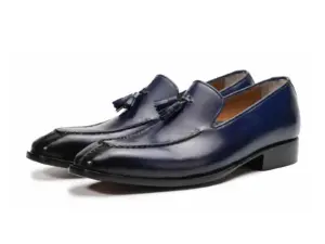 Pair of deep purple-black patina tassel loafers showing tapered apron toes